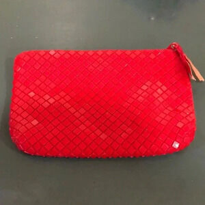 La Regale red mesh clutch.